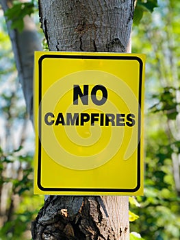 Sign or symbol no campfire, do not light a fire. No Campfires sign, in nature by sea.
