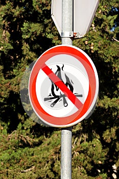 Sign or symbol no campfire, do not light a fire. No Campfires sign, in nature by sea. No open flame sign.