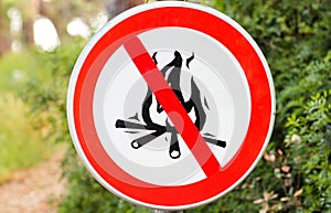 Sign or symbol no campfire, do not light a fire. No Campfires sign, in nature by sea. No open flame sign. photo