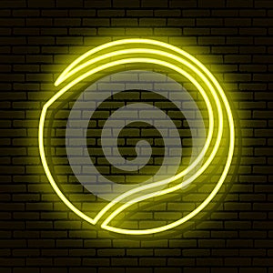 Sign of a tennis ball. Neon sign on a brick wall background. Yellow colors.