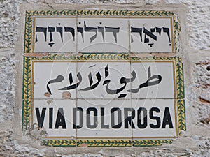 Sign in three languages of the Via Dolorosa in the old city of Jerusalem, Israel