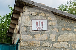Sign toilet door old stone heart outdoor wood wooden vintage, concept retro tree in sun and sanitation facility, window