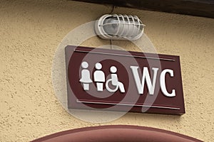 Sign on toilet WC. Restroom for men, women, people with disabilities. Water closet