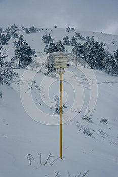 Sign on top of mountain Ai-Petri after blizzard. Crimea