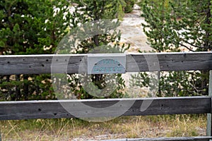 Sign for Twin Geyser, a thermal feature in the West Thumb Geyser Basin of Yellowstone National Park