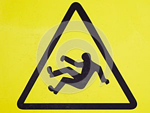 The sign is a very slippery floor. Slip on the floor. yellow photo