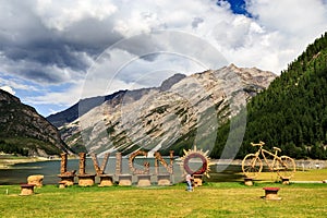 Sign at Village of Livigno near Alpine Lake