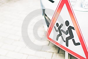 Sign: Warning children on the road. Be carefu