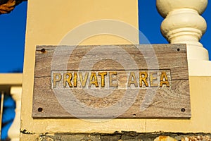 A sign warning about entering a private area, hanging on the fence of the property