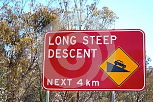 A sign warning of a long steep descent, Australia