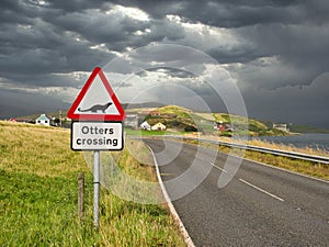 A sign warning motorists to watch for otters crossing the road near Whiteness in Shetland, Scotland, UK