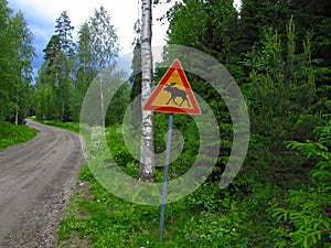 This sign warns motorists in this area to watch out for crossing moose photo