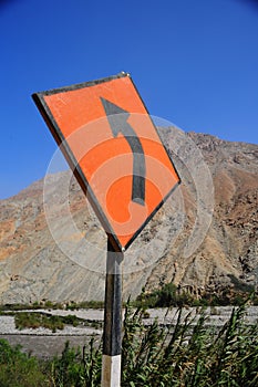 sign warns you of a change in direction or narrowing of the road ,peru
