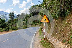 Sign winding road on a mountain road