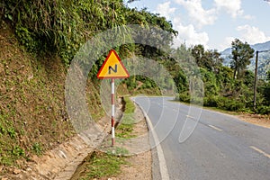 Sign winding road on a mountain road