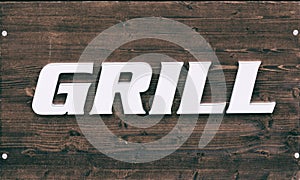 Sign on wooden table grill