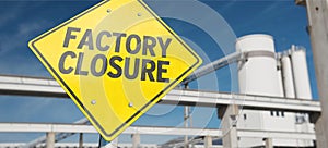 A sign with the word `FACTORY  CLOSURE`