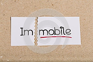 Sign with word immobile turned into mobile