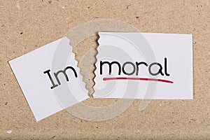 Sign with word immoral turned into moral photo