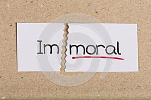 Sign with word immoral turned into moral photo