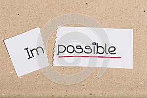 Sign with word impossible turned into possible