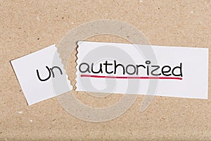 Sign with word unauthorized turned into authorized