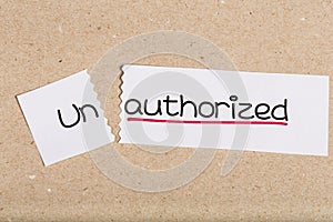 Sign with word unauthorized turned into authorized photo