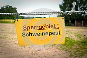 Sign with the words `African swine fever restricted area` Sperrgebiet Schweinepest