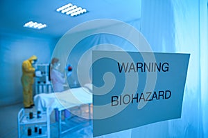 Sign with words WARNING BIOHAZARD near quarantine ward. Virus awareness