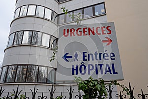 Sign indicating the directions of the emergencies department and the entrance of a hospital photo