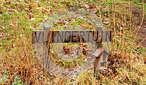 Sign wtih the text `Vlindertuin` in the early year of spring you can find butterflies