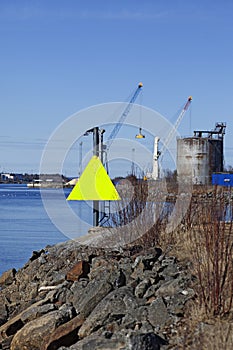 Sign with yellow triangle for shipping at port