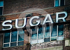 Signage on Building SUGAR for Foodie