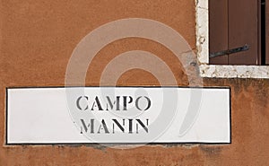 Signage campo Manin - area of Manin - in Venice at an old grunge house wall in Venice