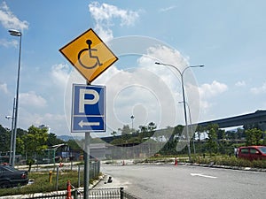 Signage for disabled parking. Established in a place reserved for the disabled.
