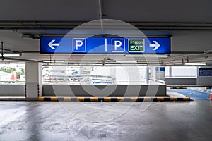 Signage Lightingbox in the indoor carparking, tell driver which way is parking lot or exit. Thai Language in green square on