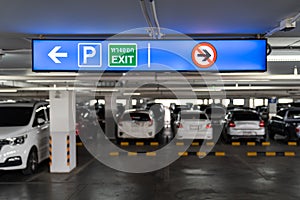 Signage Lightingbox in the indoor carparking, tell driver which way is parking lot or exit. Thai Language in green square on