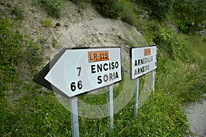 Signage at a road junction in Peroblasco to go in different directions.