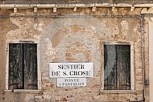 Signage sestier de S. Croce - quarter of San Croce - and Ponte San Pantalon - bridge of San Pantalon in Venice photo