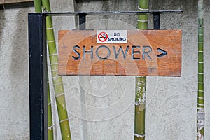 Signage to go to shower at the swimming pool with no smoking area in hotel