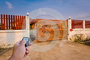 A signal of remote control show when person open automatic gate at home,motor automatic gate photo
