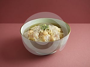 Signature Canton Jumbo Prawn Wanton Noodle with chopsticks served in a bowl isolated on mat side view on grey background