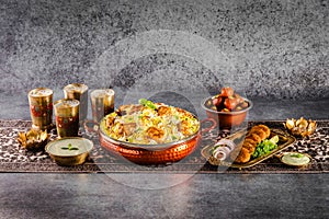 Signature Classic Combo Indian spisy food Paneer Tikka biryani with raita, shami kabab, drinks and gulab jamun Served in a dish