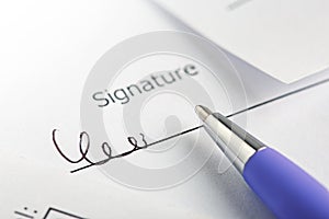 Signature of contract and agreement, accounting document with pen. Concept of banking, financial report and financial audit