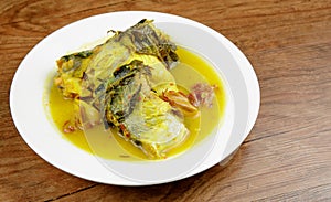 Signature dish of Pahang, Malaysia known as Gulai Patin Masak Tempoyak and Pais Patin photo