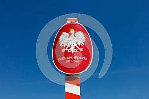 Signboard with coat of arms, national emblem and text Translation from Polish: Polish republic. Poland.