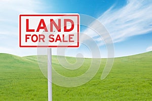 Signboard with land for sale text