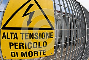 Signboard in the power station with text that means HIGH VOLTAGE