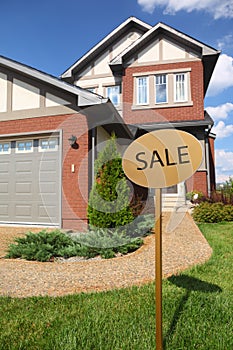 Signboard SALE on background of cottage