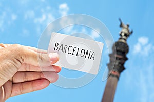 Signboard with the text Barcelona, with the Columbus Monument in photo